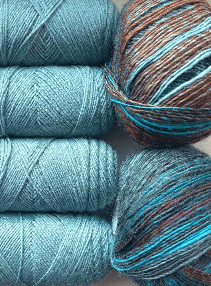 Jawoll 0372 og Mille Colori Baby 0215 i turkise og brune nuancer